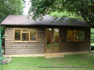 Heavy Duty Workshop Bespoke 24x14, Featheredge Cladding in dark stain, Double Glazed Windows and french Doors, Felt Tiled Facia & Soffit Roof, Guttering, T&Gv Lined & Insulated.