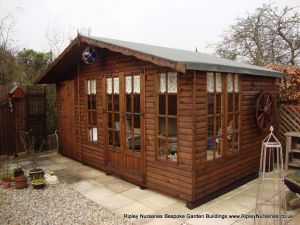 Petersham Bespoke 16x10 summerhouse  combined  Shed, Log-Lap Cladding in dark stain.