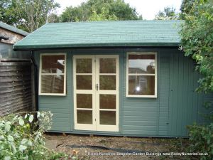 Deluxe Apex Bespoke 14x10, Extra Height, Richmond Doors, Double Glazed Sash Windows, Increased Front Roof Overhang, Felt Tiled Roof and Wild Thyme Finish.