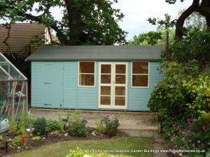 Deluxe Apex Bespoke 18x10, Richmond Doors, Sash Windows, Partitioned Shed Compartment and Beumont Blue Finish.