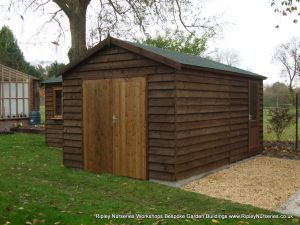 Heavy Duty Workshop 22x10 'L' shaped, Stained Featheredge Cladding, Joinery Windows and Felt Tiled Roof.