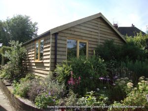 Heavy Duty Workshop 20x19, Featheredge Cladding, Grey Felt Tiled Roof, Joinery Windows Guttering.