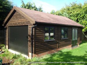 Heavy Duty Workshop 26x14, Stained Featheredge Cladding, Double Glazed Joinery Windows, Felt Tiled Roof with Facia's & Soffit's and Customers own Garage Door and French Doors.