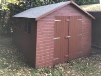Deluxe Apex 14×10 with Concrete Base and No Floor, Double Doors, Heavy Torch-On Felt and Painted Finish